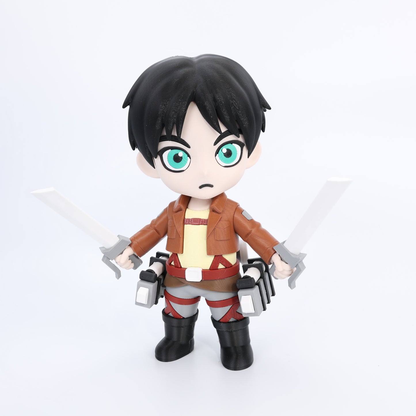 Action figure with black hair and green eyes, wearing a brown jacket and red pants, on a white background.