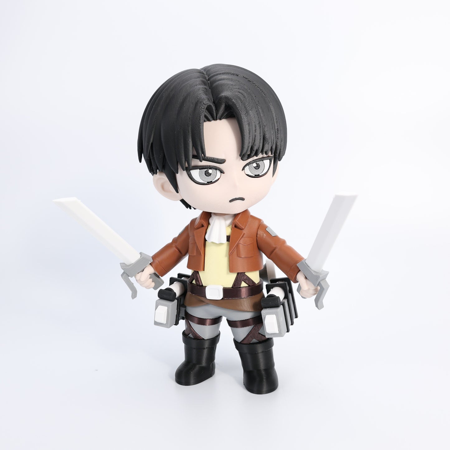 Toy figure of a character with swords on a white background